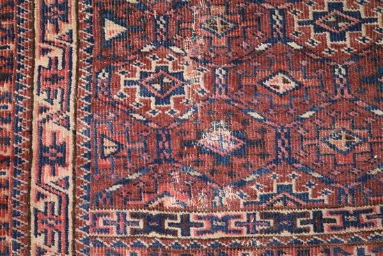 A Bokhara rug with traditional all-over panelled design, 150cm x 145cm